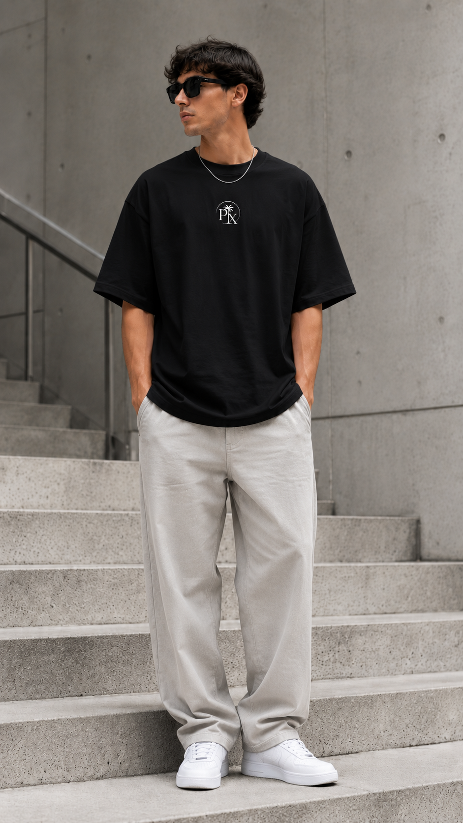 Palmex First Light Unisex-Oversize T-Shirt in Schwarz aus Bio-Baumwolle – Frontansicht.